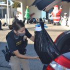 Lemoore Police Officer Escobar delivers some gifts to a local family.